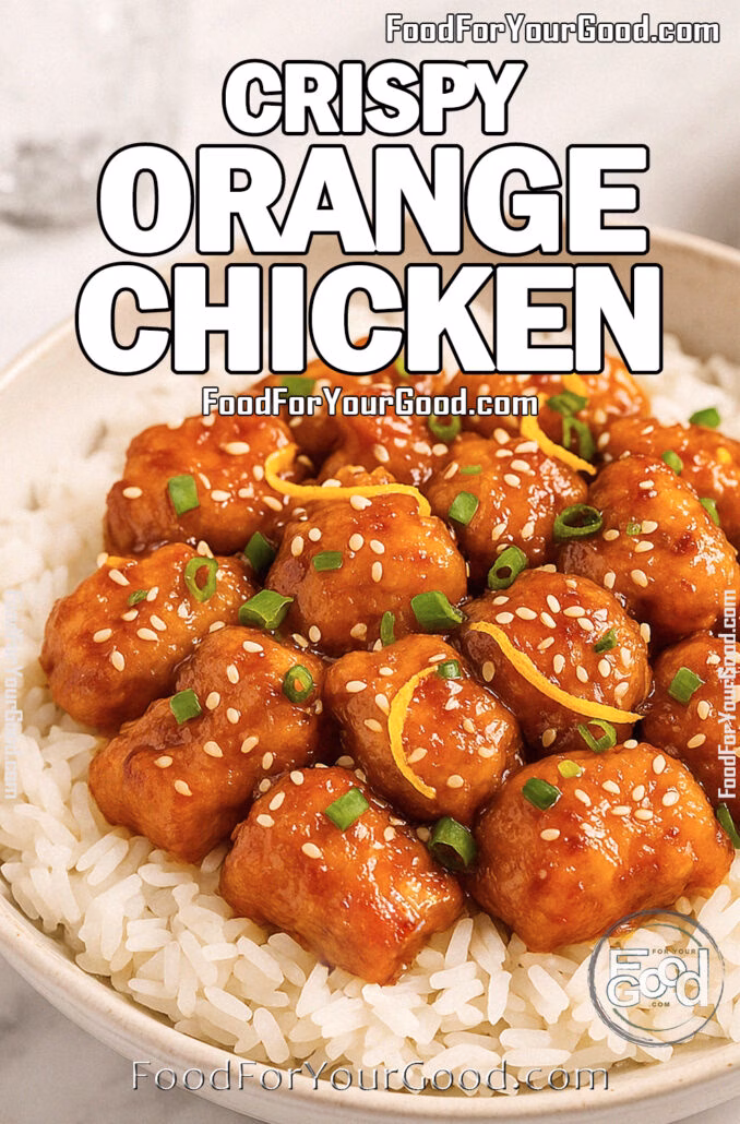 Crispy Orange Chicken served over jasmine rice, garnished with sesame seeds and green onions in a ceramic bowl on marble
