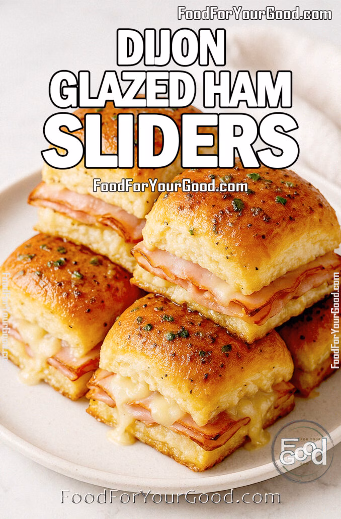 Golden Dijon Glazed Ham Sliders stacked on a plate with melted cheese and smoked ham