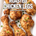 Dijon Herb Roasted Chicken Legs served on a white tray, garnished with green onions and herbs.
