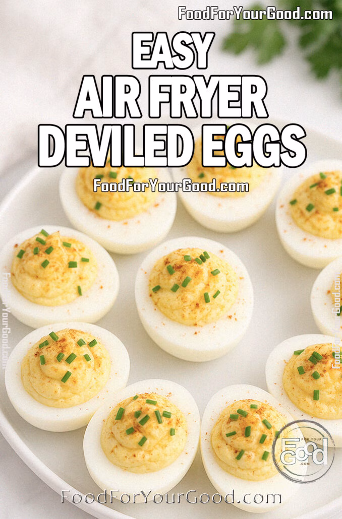 Easy Air Fryer Deviled Eggs Easy Air Fryer Deviled Eggs served on a white ceramic plate, garnished with smoked paprika and fresh chives on a white marble countertop with a blurred towel and herbs in the background.