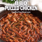 Easy Stovetop BBQ Pulled Chicken in a black cast-iron skillet, generously garnished with fresh chopped parsley, sitting on a white marble countertop with a soft linen towel and blurred herbs in the background, for FoodForYourGood.com
