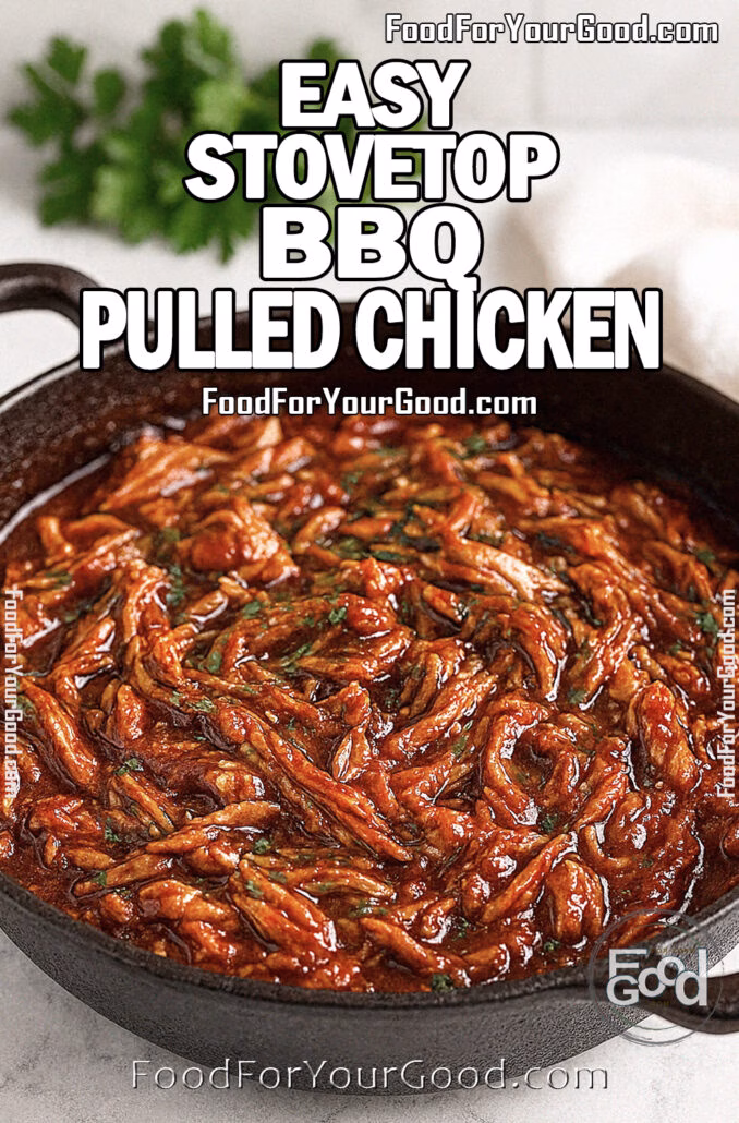 Easy Stovetop BBQ Pulled Chicken Easy Stovetop BBQ Pulled Chicken in a black cast-iron skillet, generously garnished with fresh chopped parsley, sitting on a white marble countertop with a soft linen towel and blurred herbs in the background, for FoodForYourGood.com