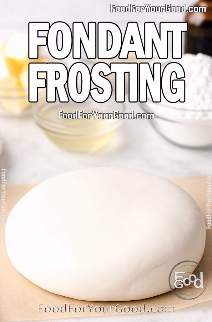 Fondant Frosting Fondant Frosting dough resting on parchment over a white marble countertop, with butter, gelatin, corn syrup, powdered sugar, and vanilla in the blurred background.