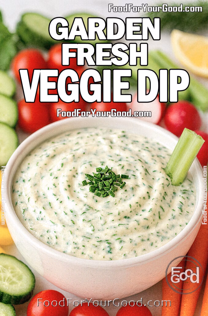 Garden Fresh Veggie Dip in a white ceramic bowl, garnished with herbs and celery, surrounded by colorful fresh vegetables on a marble surface.
