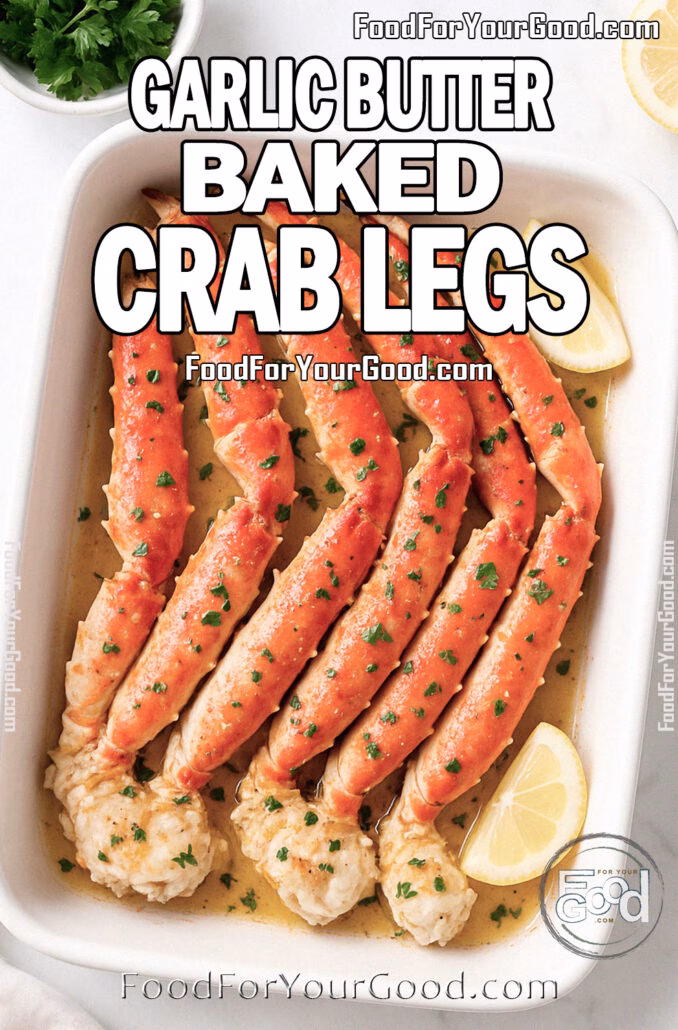 Garlic Butter Baked Crab Legs Garlic Butter Baked Crab Legs served in a white dish with lemon and parsley on marble background.