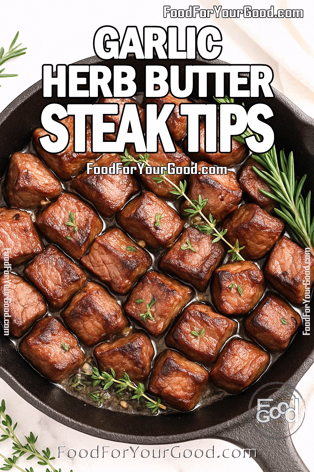 Garlic Herb Butter Steak Tips in a black cast iron skillet on a white marble background, featuring varied-sized pieces with tender edges, garnished with rosemary and thyme, and a white towel in the background.