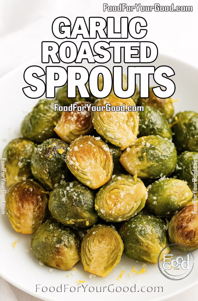 A close-up of Garlic Roasted Sprouts garnished with lemon zest and Parmesan on a white plate.