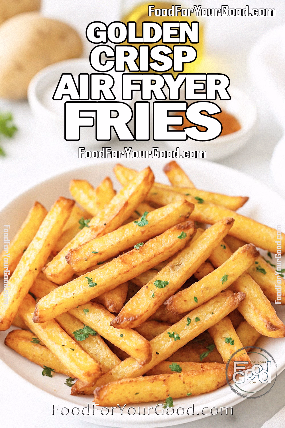 Golden Crisp Air Fryer Fries Recipe on FoodForYourGood.com Golden Crisp Air Fryer Fries in a white bowl, garnished with parsley, on a marble countertop with potatoes and spices blurred in the background.