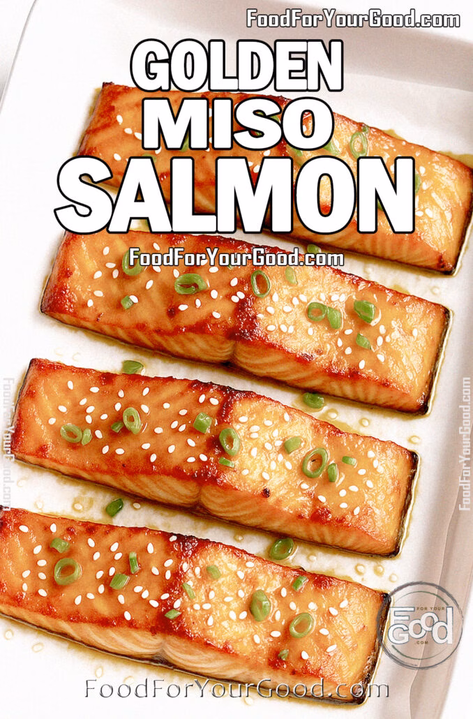 Golden Miso Salmon Golden Miso Salmon fillets roasted in a white baking tray lined with parchment paper, garnished with sesame seeds and green onions.