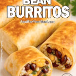 Golden brown burritos filled with black beans, rice, cheddar, and cilantro on a square white plate, served with a fresh cilantro garnish.