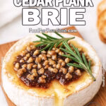 Grilled Smoky Cedar Plank Brie topped with fig jam, honey, walnuts, and rosemary, served with toasted baguette slices on FoodForYourGood.com