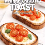 Honey Whipped Ricotta Toast with cherry tomatoes and basil on artisan bread, served on a marble cutting board with olive oil and tomatoes in the background.