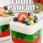 Two square glasses of Jello Fruit Parfait in portrait view with layers of strawberry Jello, lime Jello, creamy yogurt, and fruit topping.
