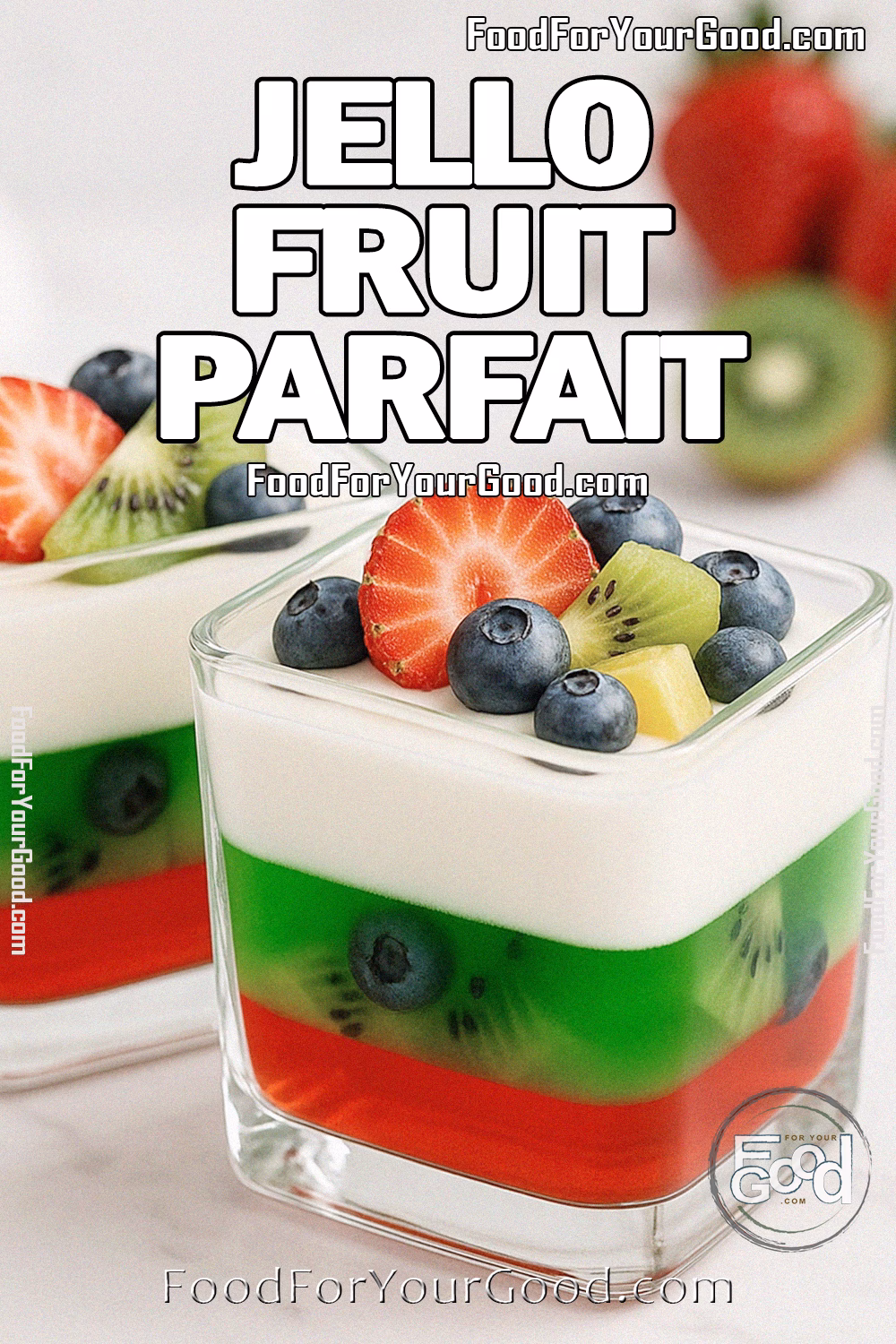 Jello Fruit Parfait Recipe – FoodForYourGood.com Two square glasses of Jello Fruit Parfait in portrait view with layers of strawberry Jello, lime Jello, creamy yogurt, and fruit topping.