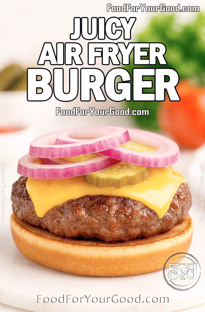 Juicy Air Fryer Burger patty with melted cheddar, pickles, and red onion rings on a toasted bun, styled on a marble board for FoodForYourGood.com