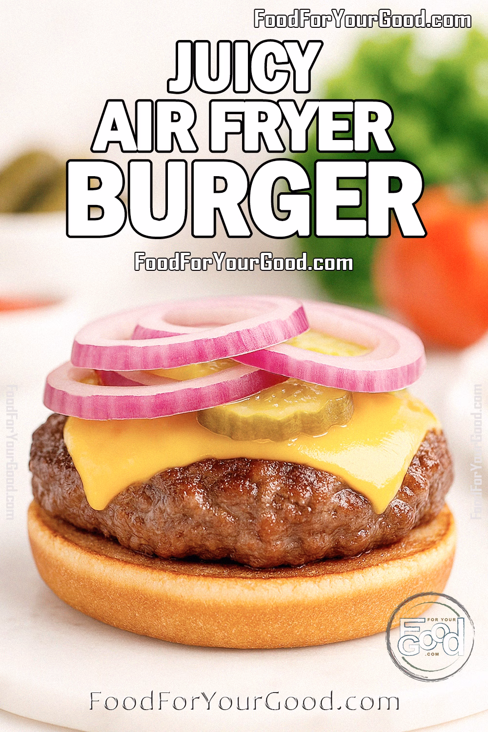 Juicy Air Fryer Burger patty with melted cheddar, pickles, and red onion rings on a toasted bun, styled on a marble board for FoodForYourGood.com