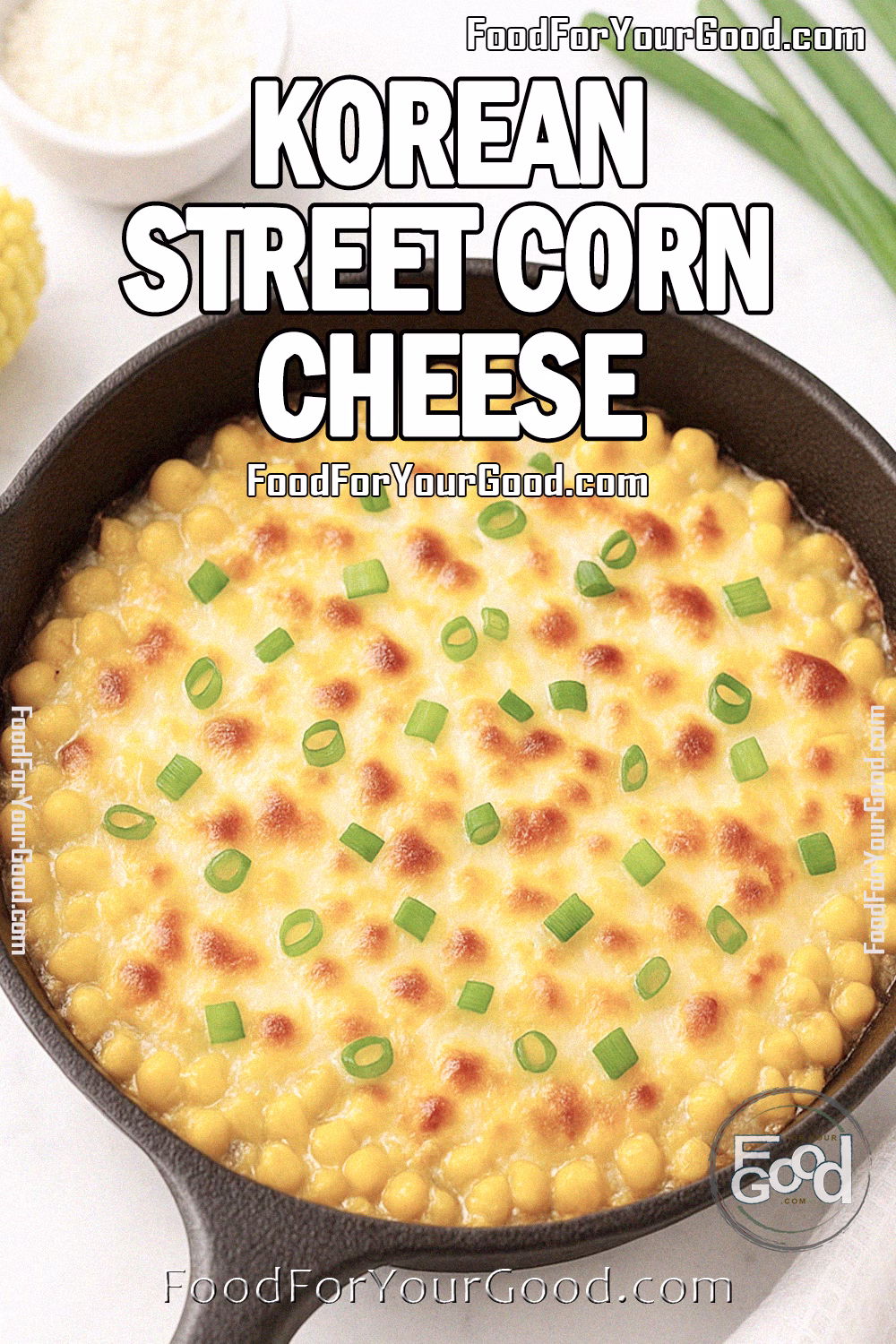 Korean Street Corn Cheese Recipe - FoodForYourGood.com Korean Street Corn Cheese baked in a cast-iron skillet with golden, bubbly cheese and green onion garnish, on a marble surface.