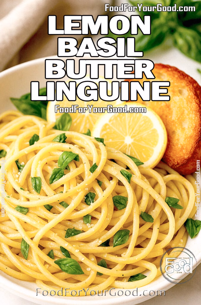 A bowl of Lemon Basil Butter Linguine with lemon slices, crispy bread, and fresh basil on marble.