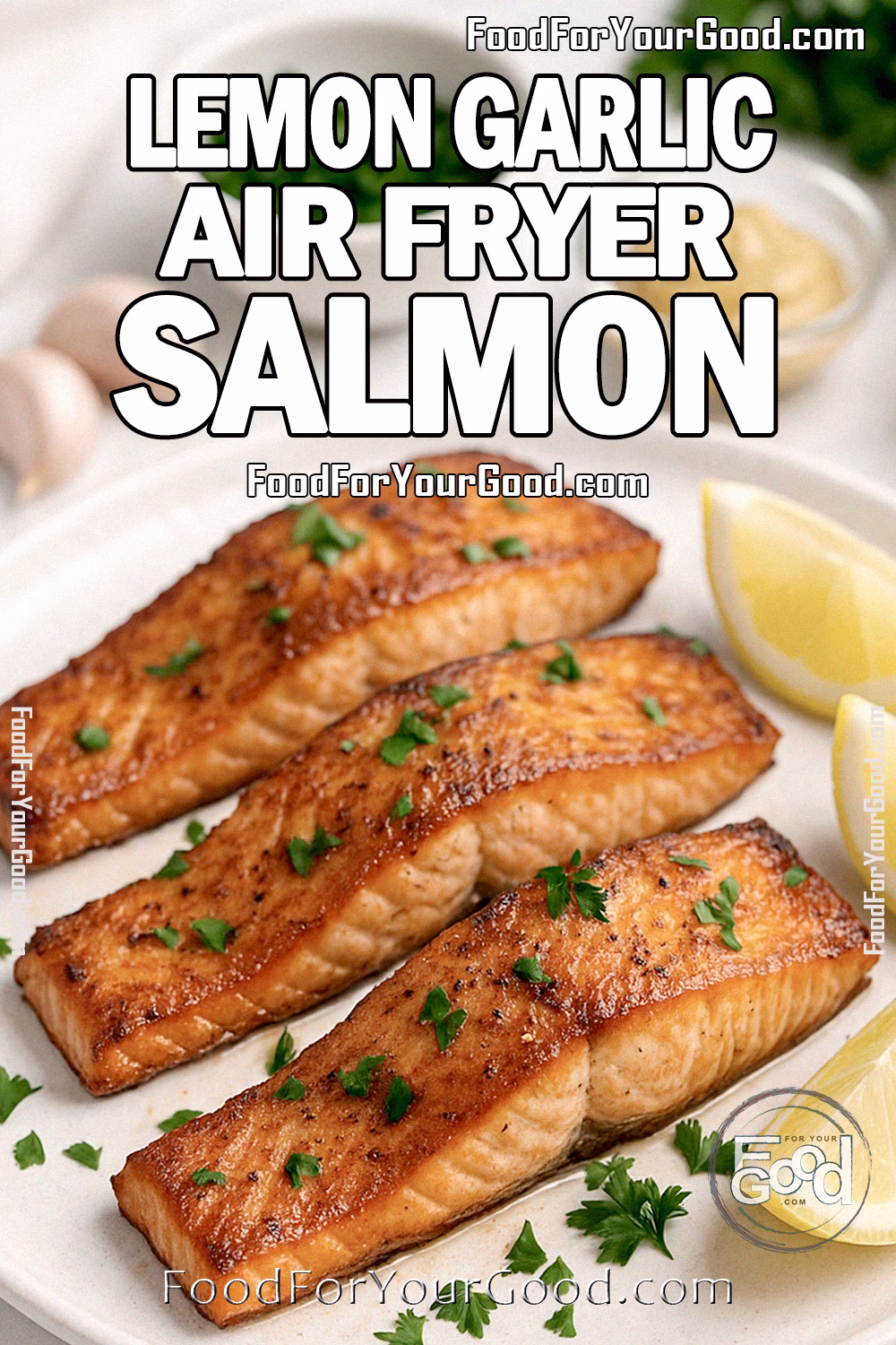 Air Fryer Salmon fillets with lemon wedges and parsley served on a white plate, styled on a marble countertop with fresh ingredients in the background.