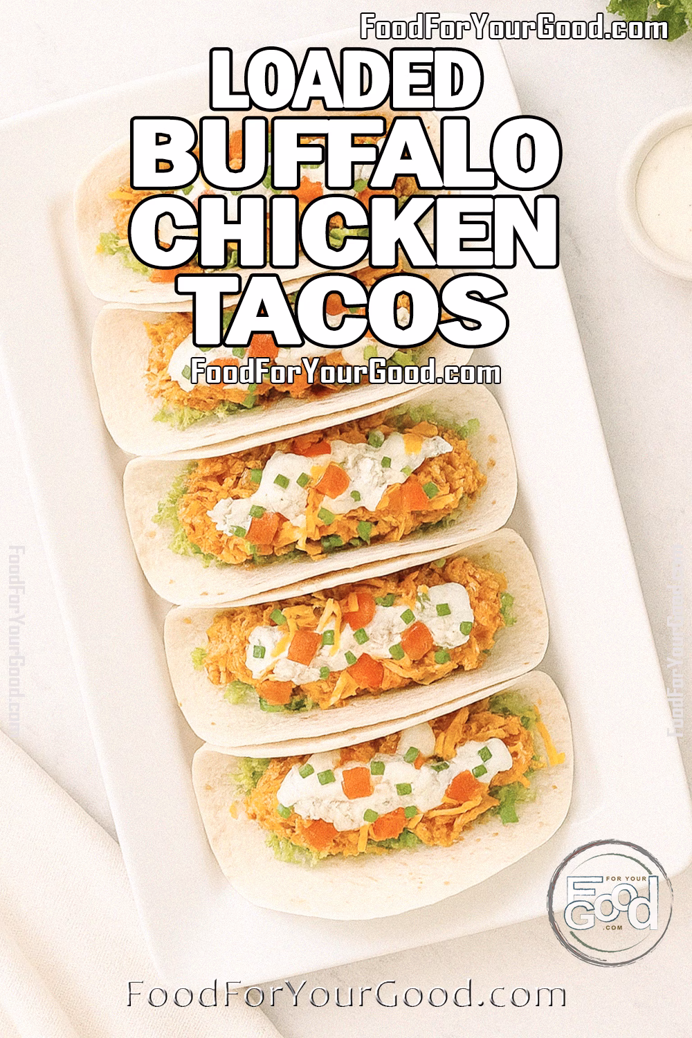Loaded Buffalo Chicken Tacos neatly arranged on a white rectangular platter with fresh toppings, photographed on a marble surface at FoodForYourGood.com