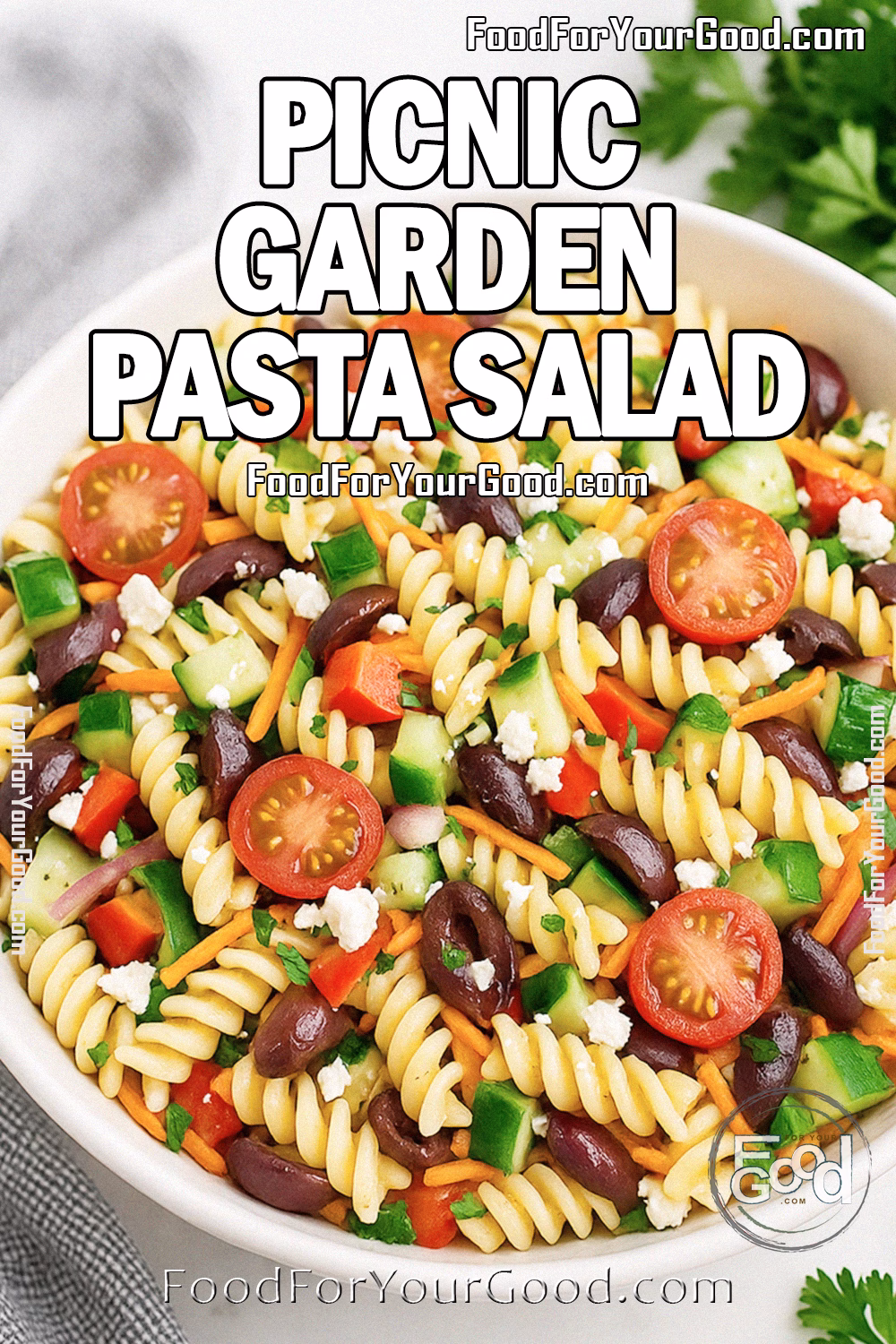 Picnic Garden Pasta Salad in a white bowl on marble counter with fresh parsley and gray towel