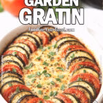 Rustic Summer Garden Gratin in a white ceramic dish with layers of zucchini, eggplant, and tomatoes topped with golden cheese and fresh basil, placed on a marble countertop with fresh vegetables and a white towel in the background.
