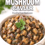 Rustic Mushroom Caviar in a white ceramic bowl on marble countertop with fresh parsley garnish, mushrooms, and garlic in the background on FoodForYourGood.com