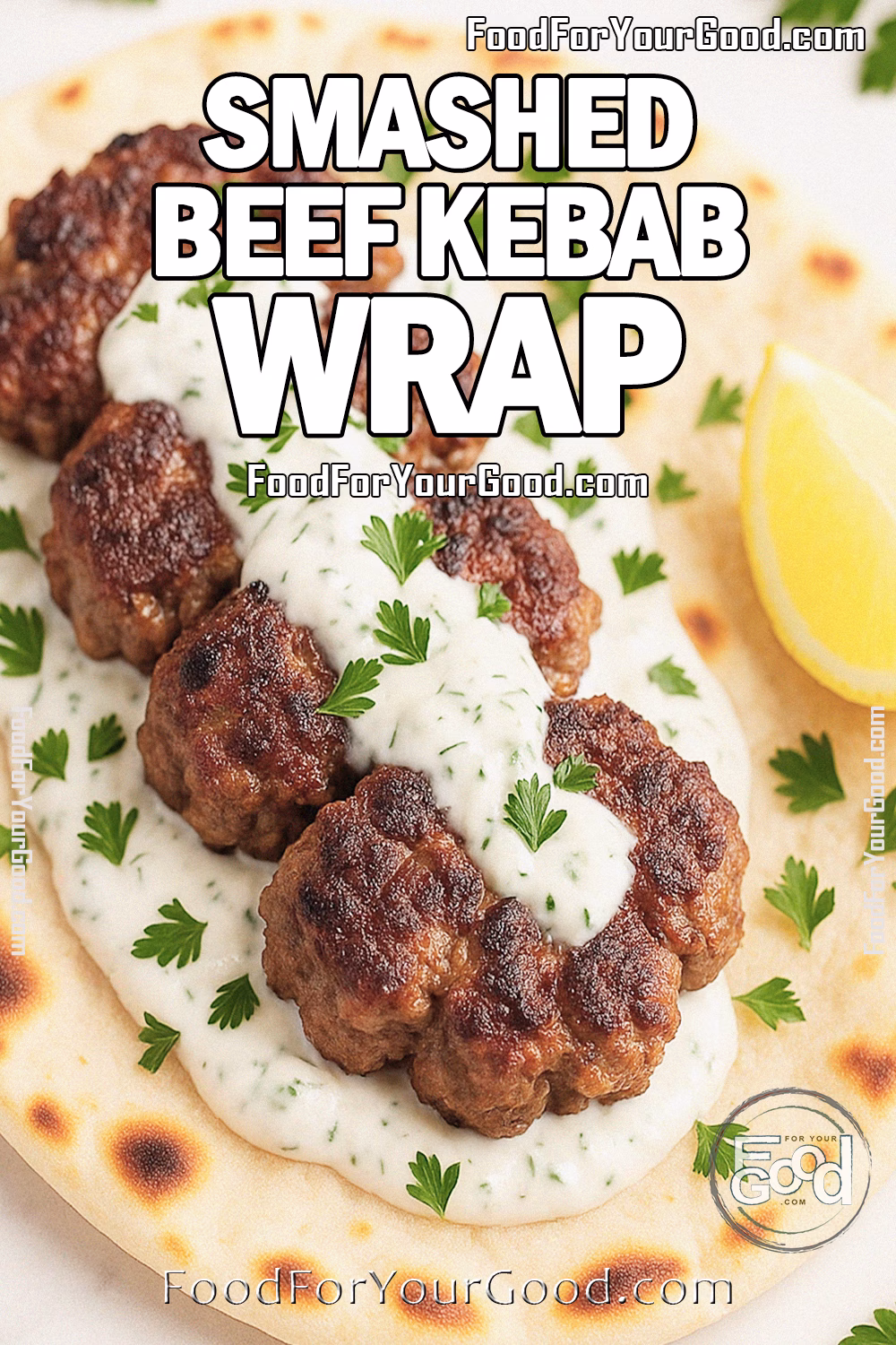 Smashed Beef Kebab Wrap with Cucumber Yogurt Recipe | FoodForYourGood.com Smashed Beef Kebab Wrap with cucumber yogurt sauce, juicy beef patties in warm flatbread with parsley and lemon on marble.