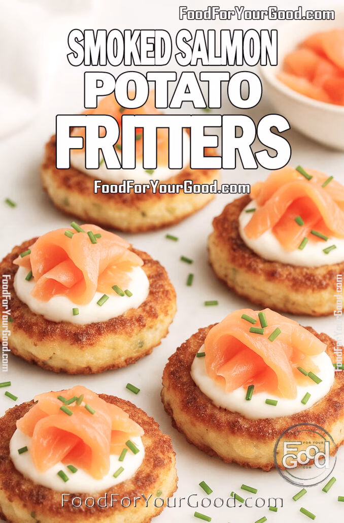 Smoked Salmon Potato Fritters Portrait photo of Smoked Salmon Potato Fritters on a white ceramic plate over marble, topped with sour cream, smoked salmon, and chives.