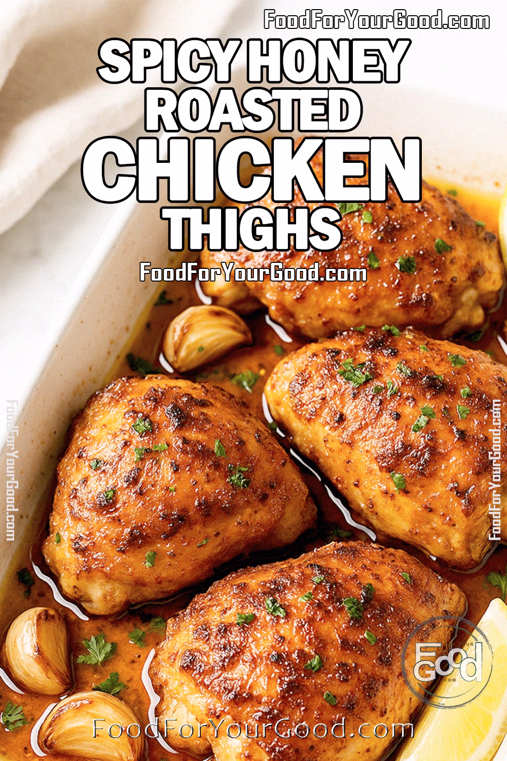Spicy Honey Roasted Chicken Thighs with crispy golden skin in a white baking dish, garnished with garlic and lemon wedges.