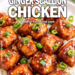 Sticky Ginger Scallion Chicken served over jasmine rice, garnished with scallions and sesame seeds, on a modern ceramic plate.