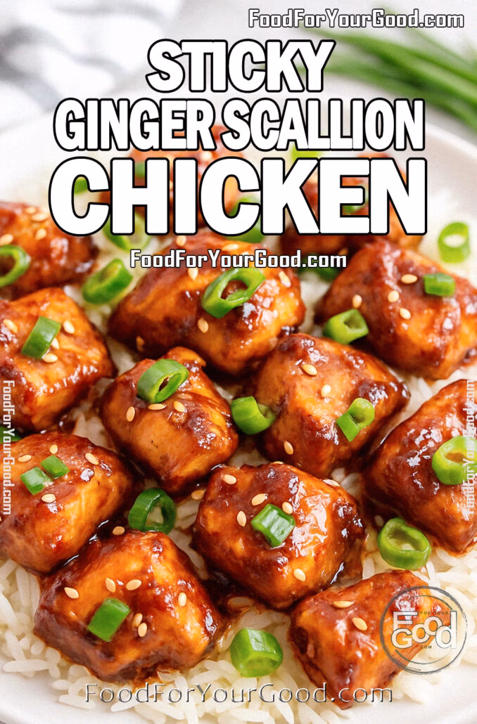 Sticky Ginger Scallion Chicken served over jasmine rice, garnished with scallions and sesame seeds, on a modern ceramic plate.
