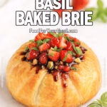 Strawberry Basil Baked Brie on FoodForYourGood.com – golden puff pastry baked Brie topped with strawberries, basil, pistachios, and balsamic glaze on a marble tray.