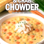 A creamy bowl of Sweet Corn & Crab Chowder garnished with fresh chives, surrounded by corn, potatoes, carrots, and herbs on a white marble background.