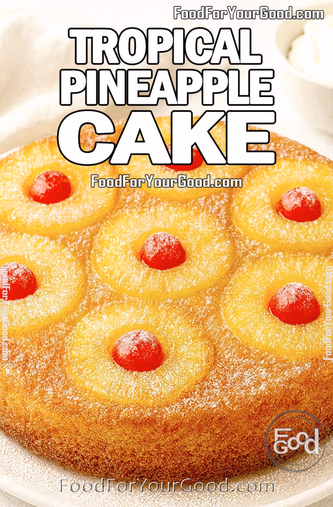 Tropical Pineapple Cake with powdered sugar, baked pineapple rings, and cherries on a white plate over white marble, with a towel in the background for FoodForYourGood.com