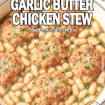 Tuscan Garlic Butter Chicken Stew with cannellini beans, golden chicken thighs, and fresh parsley in a beige skillet on marble countertop, styled with a wooden spoon and linen.