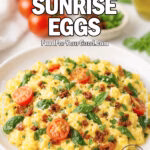 Tuscan Sunrise Eggs with cherry tomatoes, spinach, and basil on a white marble countertop.
