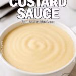 Vanilla Bean Custard Sauce in a white bowl on marble with vanilla beans and towel – FoodForYourGood.com