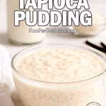 Vanilla Bean Tapioca Pudding in a glass bowl on marble countertop with milk, tapioca pearls, and vanilla beans in the background.