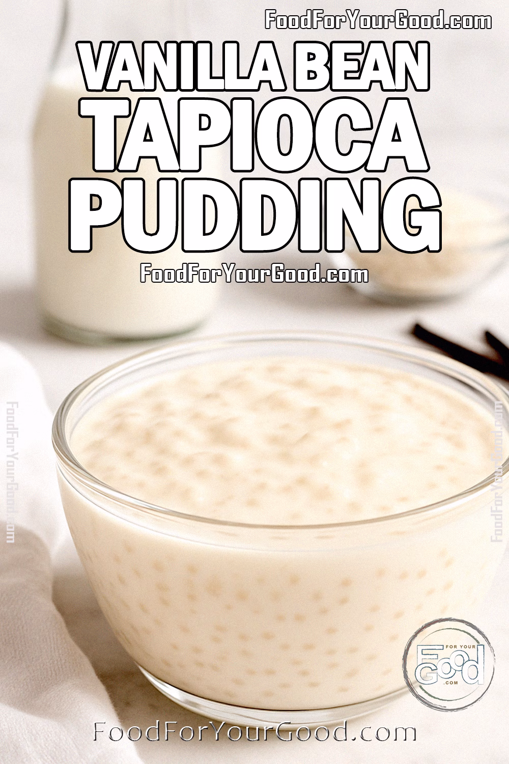 Vanilla Bean Tapioca Pudding in a glass bowl on marble countertop with milk, tapioca pearls, and vanilla beans in the background.
