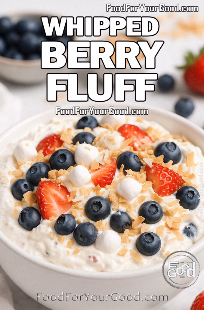 Whipped Berry Fluff Whipped Berry Fluff in a white bowl topped with fresh strawberries, blueberries, marshmallows, graham cracker crumbs, and toasted coconut on a marble background.