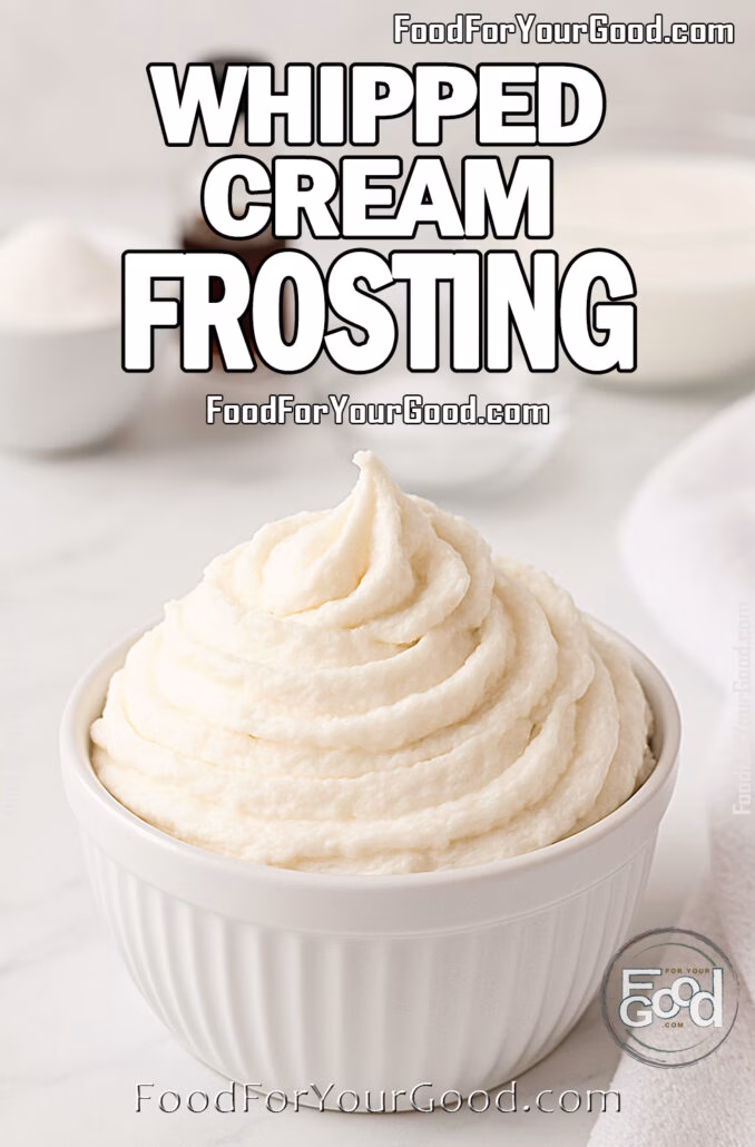 Whipped Cream Frosting Whipped Cream Frosting in a white ceramic bowl on a marble countertop, surrounded by blurred ingredients like cream, sugar, and vanilla.