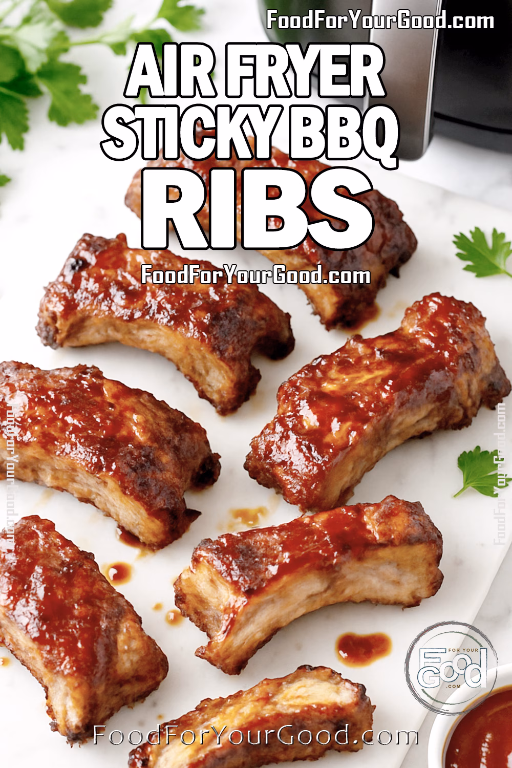 Air Fryer Sticky BBQ Ribs on a white marble board, glazed with rich barbecue sauce, styled with parsley and a bowl of sauce beside an air fryer in the background.