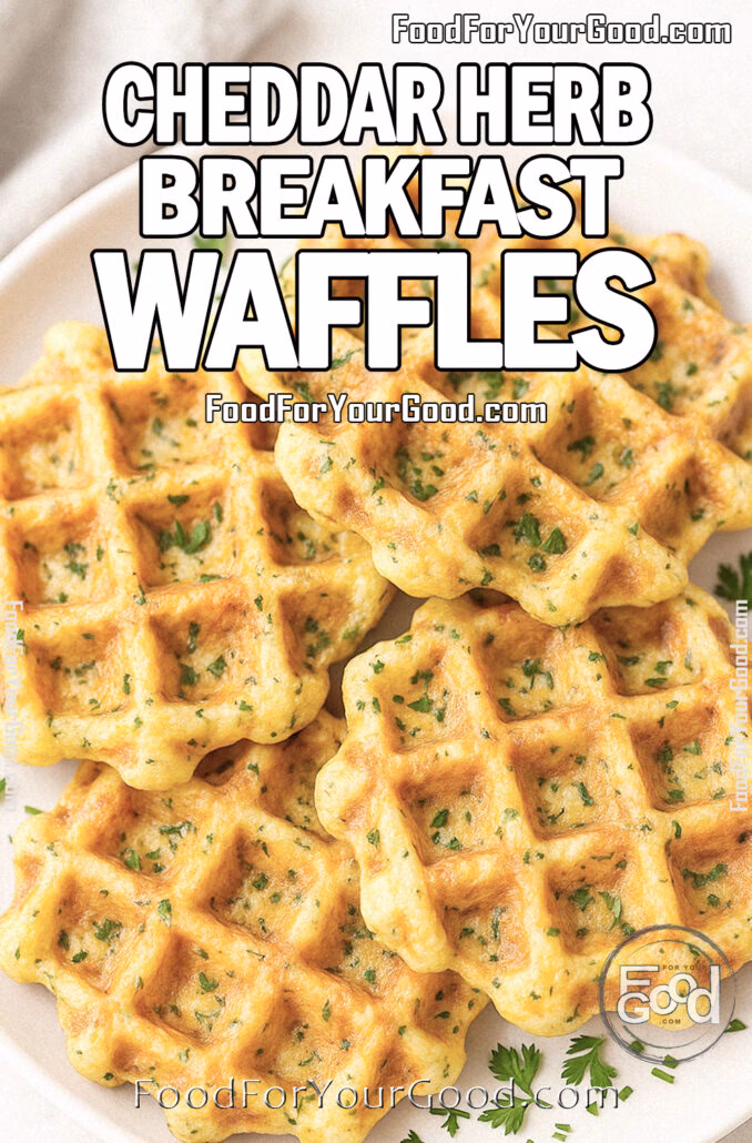 Cheddar Herb Breakfast Waffles Cheddar Herb Breakfast Waffles served golden and crispy on a white plate, garnished with fresh herbs, styled on marble in bright daylight.