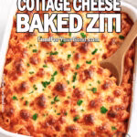 Creamy Cottage Cheese Baked Ziti baked until golden and bubbly in a white square dish with parsley garnish on FoodForYourGood.com