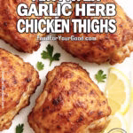 Crispy homemade air fryer chicken thighs with golden skin, served on a white square plate with lemon wedges and parsley garnish.