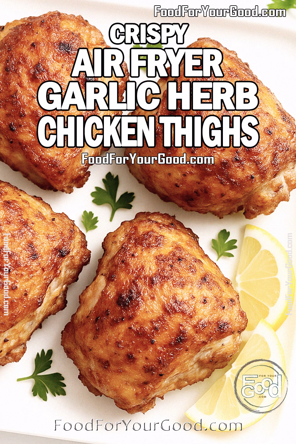 Crispy Air Fryer Garlic Herb Chicken Thighs Recipe | FoodForYourGood.com Crispy homemade air fryer chicken thighs with golden skin, served on a white square plate with lemon wedges and parsley garnish.