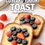 Golden Custard Yogurt Toast on a white marble board, thick brioche slices filled with creamy custard, topped with fresh berries, and dusted with powdered sugar. Styled with bowls of yogurt, berries, and honey in the blurred background.