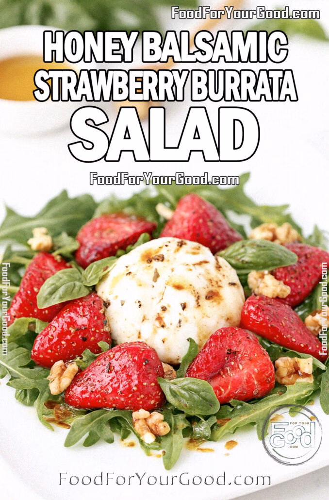Honey Balsamic Strawberry Burrata Salad on a heavy white square plate with arugula, strawberries, walnuts, and basil, drizzled with honey balsamic vinaigrette on a white marble surface.