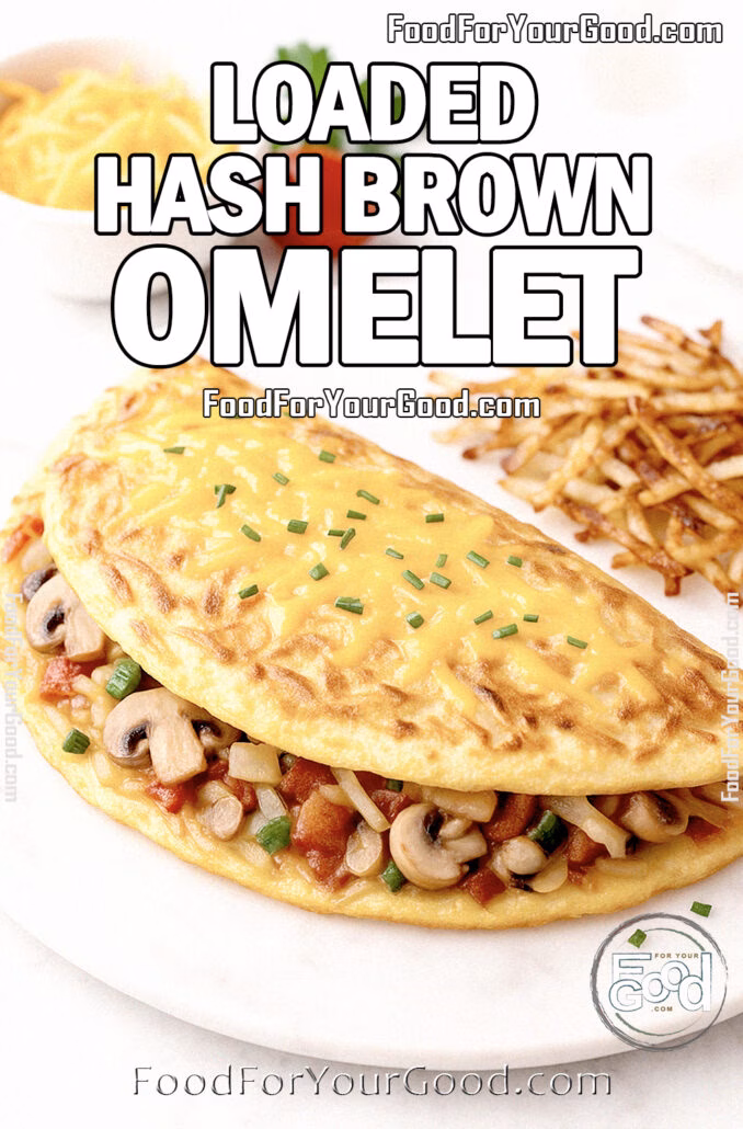 Loaded Hash Brown Omelet topped with melted cheddar cheese, filled with mushrooms, peppers, onions, and served with crispy hash browns on FoodForYourGood.com